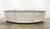 Custom-made Italian curved conversation sofa featuring an elegant sculptural silhouette upholstered in soft gray leather...