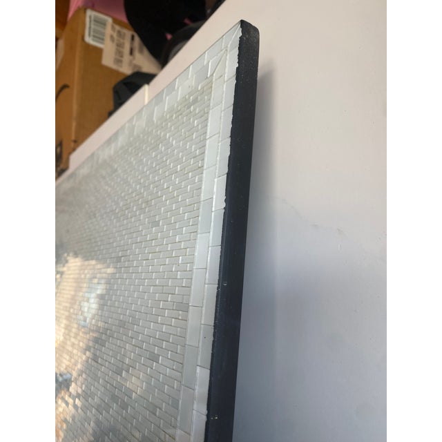 An exquisitely detailed mosaic, featuring twenty-seven thousand stained monochrome glass pieces, evoking pleasure and...