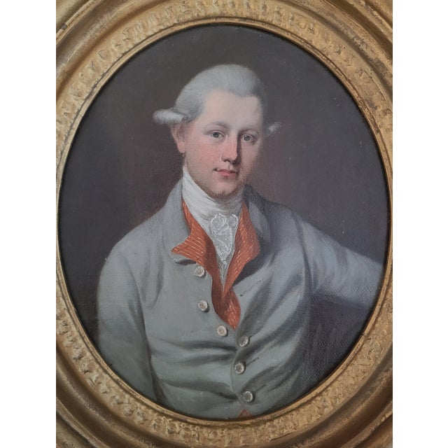 Exceptional antique oil painting of a handsome young gentleman in 18th century attire. The medium is oil on canvas laid to...