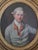 Exceptional antique oil painting of a handsome young gentleman in 18th century attire. The medium is oil on canvas laid to...