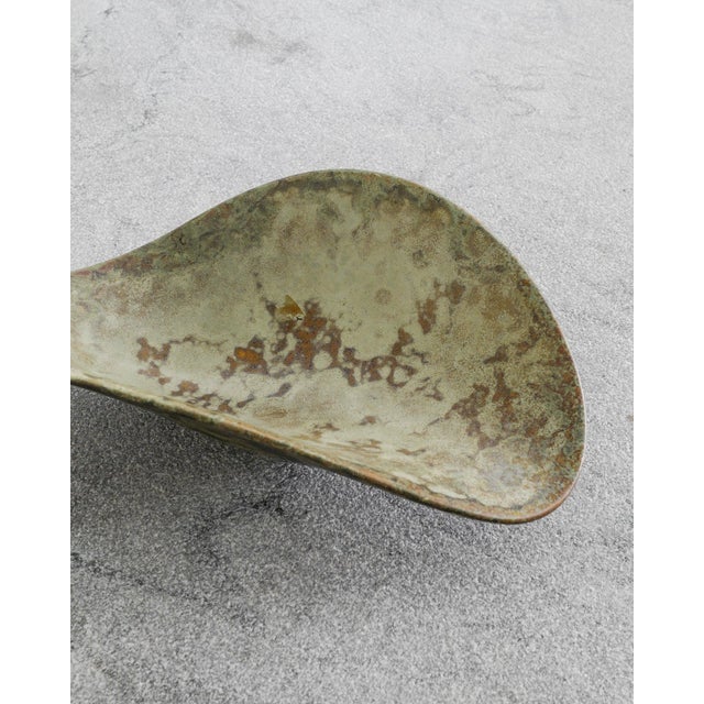 A rare and unique swedish mid century free form stoneware dish bowl with a decorative green spreckled glaze by the swedish...