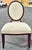 A Baker Furniture Oval X-Back Dining Side Chair designed by Barbara Barry. Mahogany stained and cream velvet upholstery....