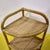 Bamboo and rattan corner shelf with three shelves.