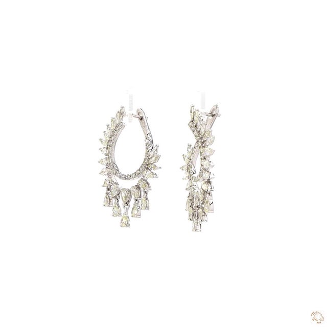 This pair of estate earrings from our contemporary estate collection centers on a 4.17-carat diamond in a round brilliant...
