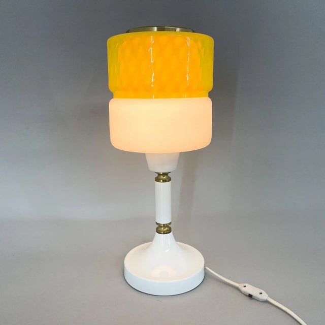 Vintage table lamp manufactured by Drukov in former Czechoslovakia in the 1970s. Made of metal, brass and coloured glass....