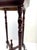 A mid-20th century English Regency Revival plant stand featuring a solid white marble top with elegant gray veining...
