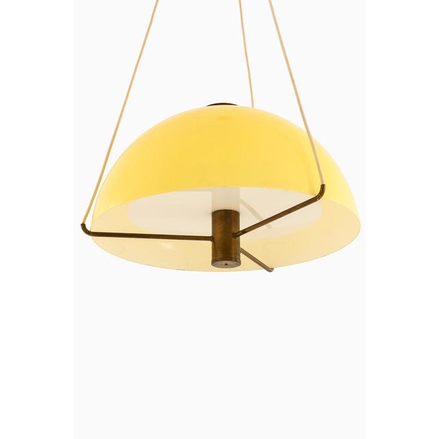 This rare ceiling lamp, designed by Anders Pehrson and produced by Ateljé Lyktan in Åhus, Sweden, during the 1960s, is a...