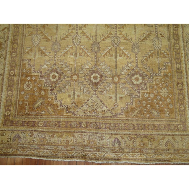 Khotan gallery rug with nice all-over geometric palette in a predominant straw color. Outline colors in ivory and brown...