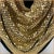 This is a signed Whiting & Davis Chainmail Scarf Necklace. It is a 70s disco fever 18 x 9 x 9 inch gold-tone mesh triangle...