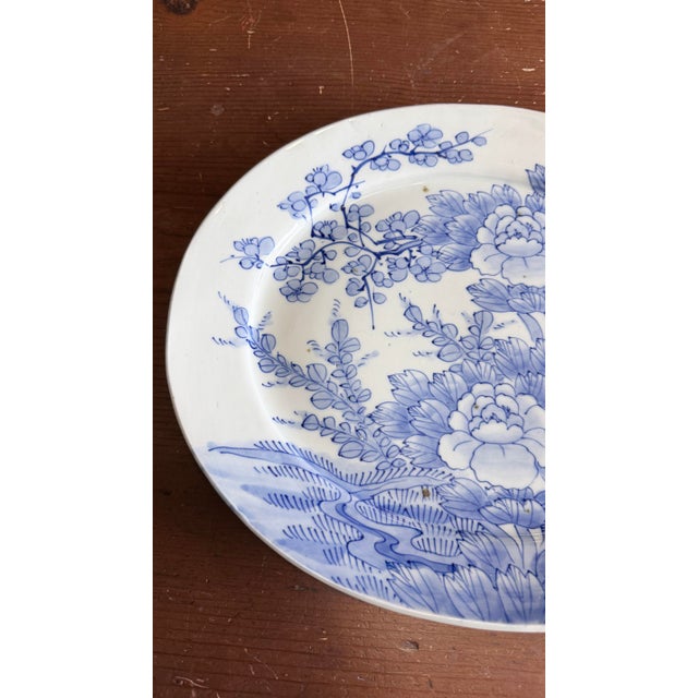 Antique Japanese Blue and White Porcelain Oval Serving Platter, Meiji Period, Circa 1870s–1900s A boldly decorated and...