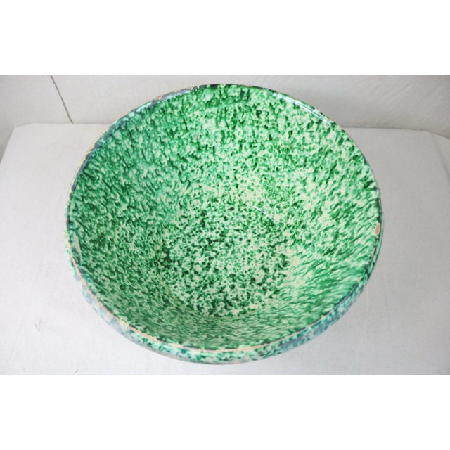 A very ornate late 19th century Italian pottery milk bowl. Typical of this type of pottery, there is minor usage wear and...