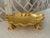 Sherle Wagner soap dish. In the form of a shell balancing on turtle feet. Elegant gold shell-shaped dish with intricate...