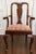 A set of eight (two arm and six side chairs) mahogany upholstered dining chairs with a central baluster splat above drop-...