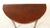 This late 18th - early 19th century table features elegantly tapered legs ending on casters. Appears to be the end portion...