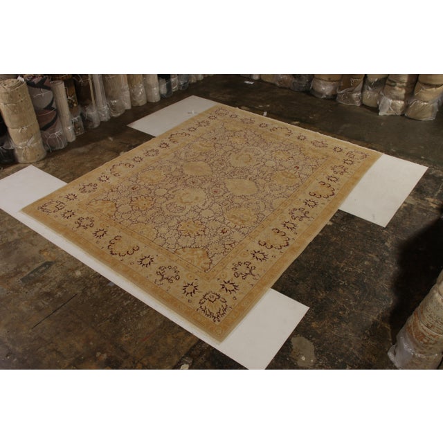 Made with hand-knotted wool in 9x12 size circa 1980, this vintage Agra rug hails from the one of the earliest traditional...