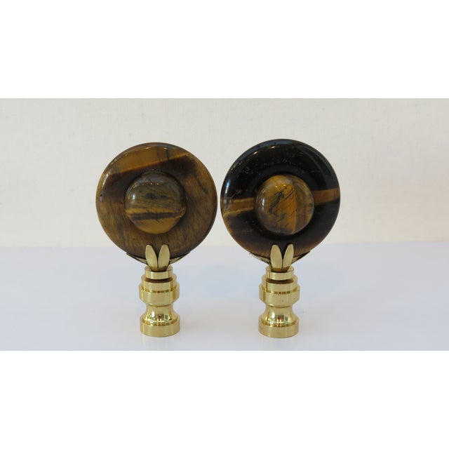 Cabochon style polished Tiger Eye finials in brass bases. Gorgeous detail in the stones. Round shape with round inset on...
