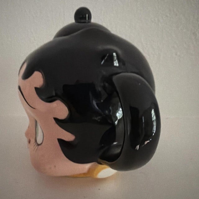 The Vintage Betty Boop Teapot by Vandor 1997 is a collectible porcelain and ceramic tea pot featuring the iconic cartoon...