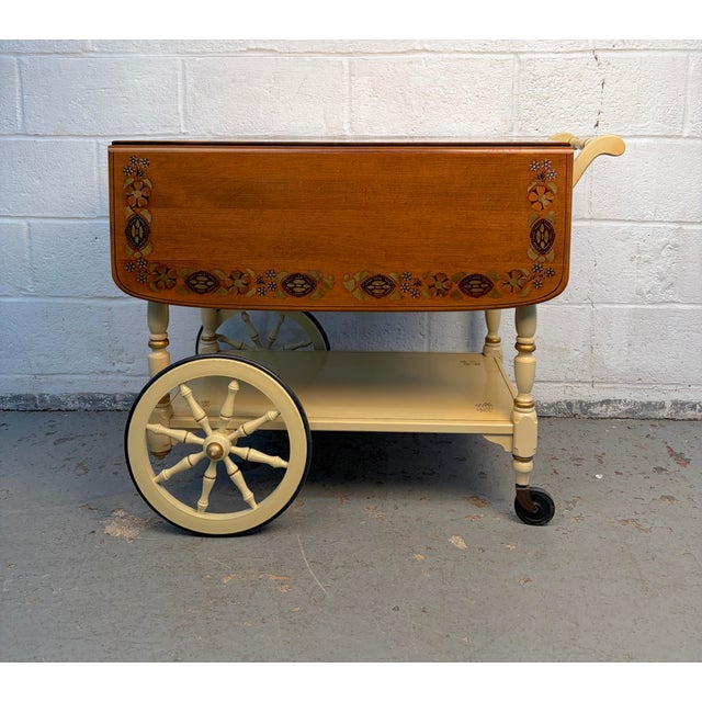 Charming and functional, this vintage Ethan Allen tea cart showcases classic craftsmanship with timeless appeal. Featuring...