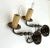 Beautifully made pair of vintage brass wall sconces with natural wax faux-candles, electrified for candelabra bulbs and...