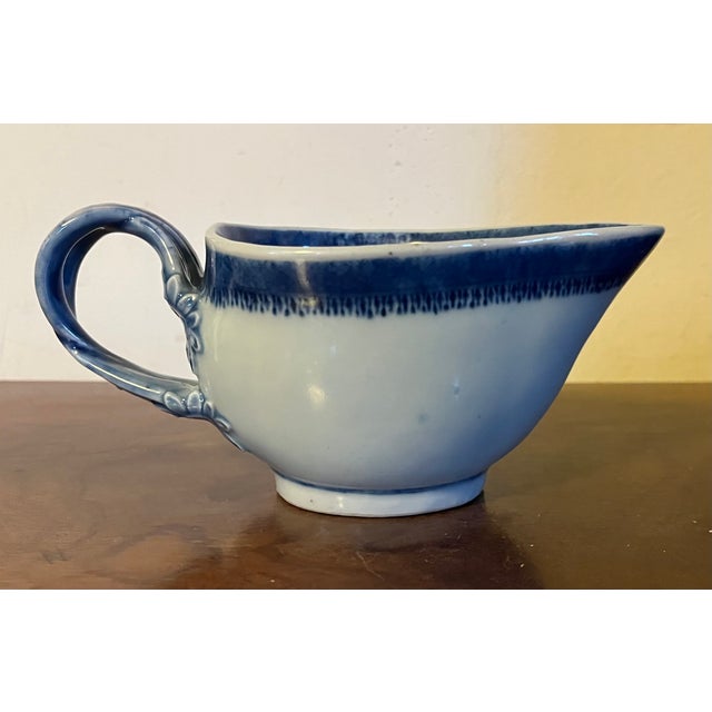 Antique early 19th century Chinese export Canton porcelain sauce or gravy boat decorated with a blue & white landscape...