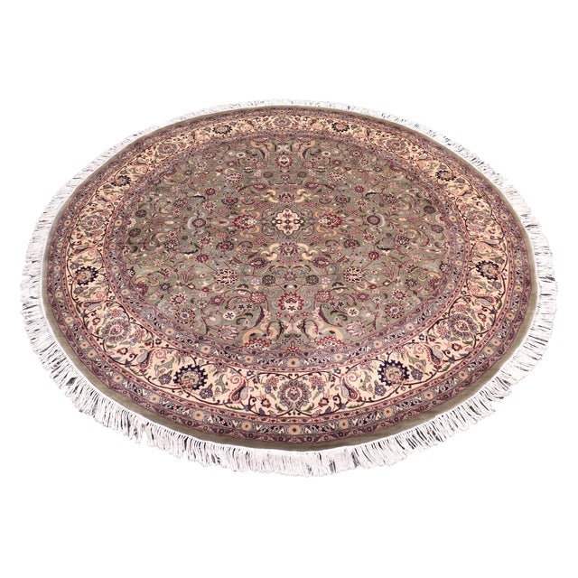 This hand‑knotted Pak Persian round rug showcases the finest expression of traditional Persian artistry. Each piece is...