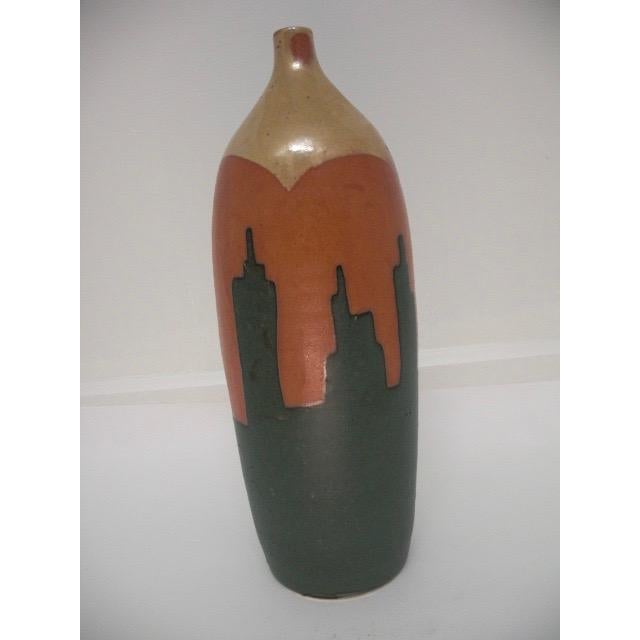 This vintage, studio ceramic vase has a gorgeous, three-color glaze design. The unique design has a tan glaze at the top...
