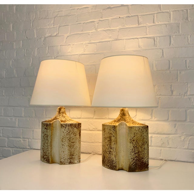 Danish Mid-Century stoneware table lamps of the 1970s by Haico Nitzsche. Sculptural lamps in earthy colored glazed...