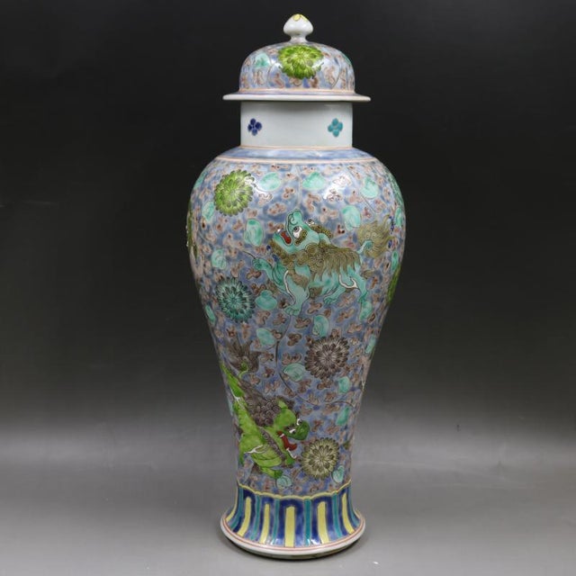 H-46.5cm,W-21cm. This Chinese Ceramic Pot from the Qing Dynasty features a Kangxi Mark and a hand-painted pattern of Foo...