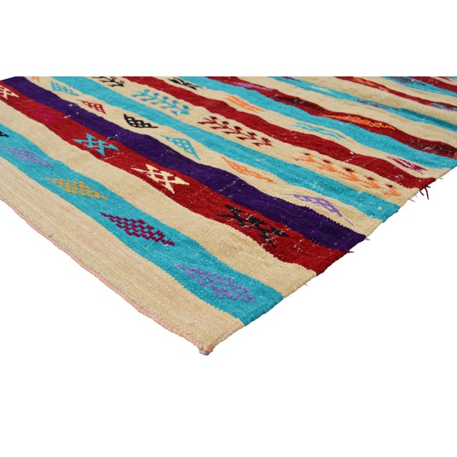 Hand-Knotted Moroccan Berber kilim with a design of natural symbols and geometric shapes. This gorgeous rug ships within...