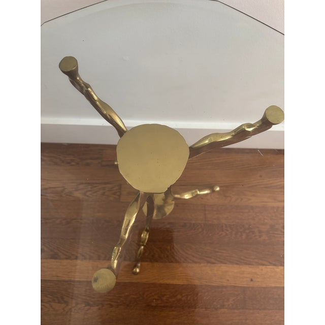 Custom designed brass side table with geometric beveled glass top. Quirky organic take on a more traditional form tripod...