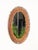Marvelous French Riviera style oval mirror in bamboo, curved rattan and hand-woven wicker. This elegant and unique organic...