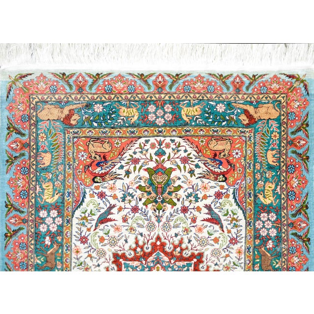 A beautiful vintage Chinese hand-knotted silk rug with a large central medallion resting on a field of scrolling vines,...