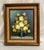 A vibrant Mid-Century era oil on canvas still life depicting yellow flora and fauna in vase in a wood frame with burlap...