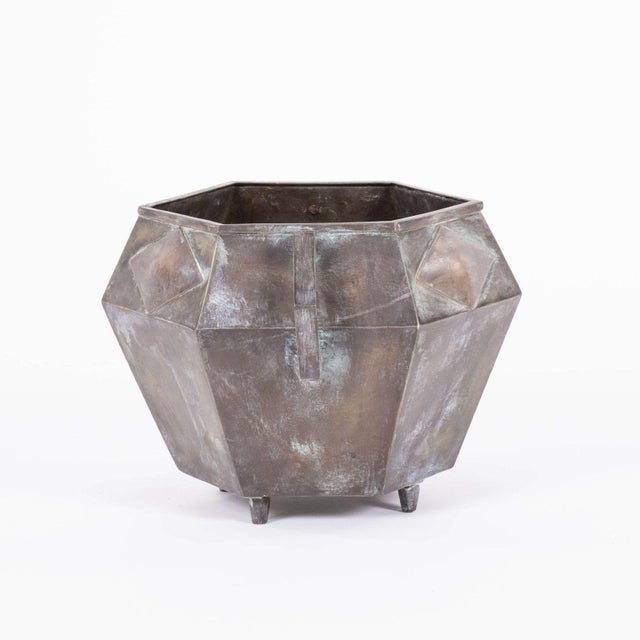 Bronze French polygon-shaped jardinière, circa 1925-1935. Two shaped handles mirror the raised diamond-shape decoration...