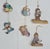 A charming and increasingly hard-to-find set of four Disney Goebel It's a Small World hand-painted ceramic ornament...