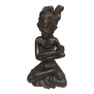 Mid 20th Century Balinese Macassar Ebony Wood Seated Young Boy Sculpture by K. Aria (Mas, Bali) For Sale
