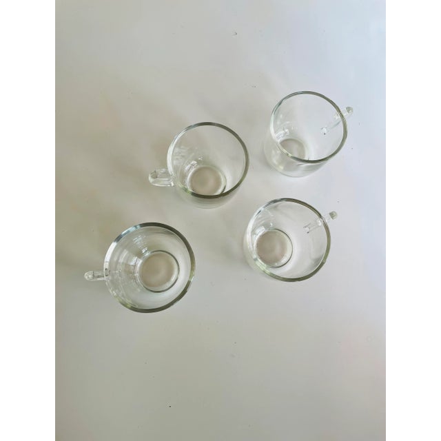 Vintage set of 4 clear glass punch cups 2-5/8” H X 3.5”W X 2.75”D in Very good condition.