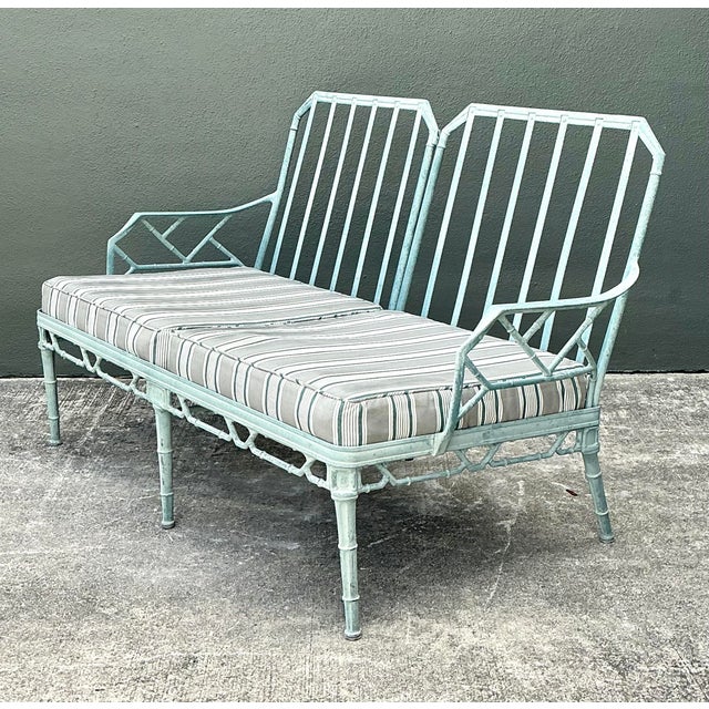 This elegant vintage love seat is a classic example of Hollywood Regency outdoor design, heavily inspired by the iconic...