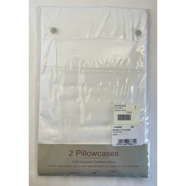 These are luxury-quality satin-weave king pillowcases made in Italy. They are white and have a wide cuff with a...