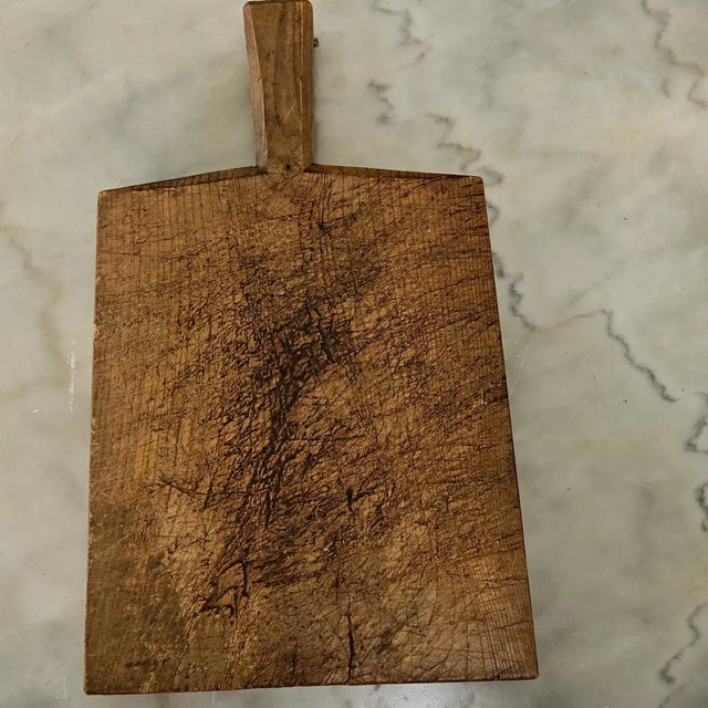 Dimensions: 16 ⅝ ” H x 10 ⅛ ” W x ⅝ ” D Exceptional oak chopping block from France, 19th century. The solid wood plank is...