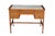This antique 19th Century mahogany Sheraton-style writing desk is a refined example of Neoclassical design, balancing a...