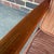This is a beautiful Danish teak lounge chair designed by John Stuart for Ole Wanscher. It has a teak frame with Ole...