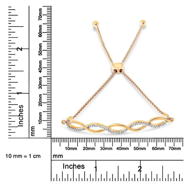 Early 21st Century 14K Yellow Gold Plated .925 Sterling Silver 1/10 cttw Diamond Infinity Twist 4���-10��� Adjustable Bolo Bracelet (I-J Color, I2-I3 Clarity) For Sale - Image 5 of 5
