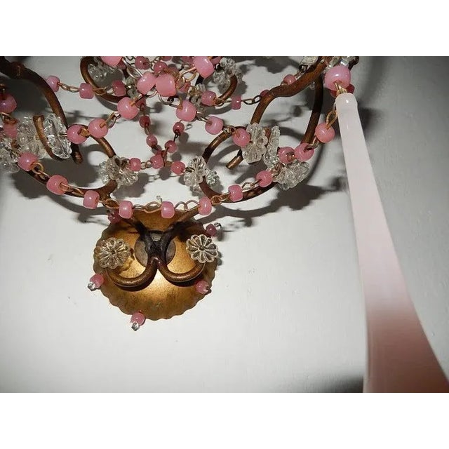 Housing 2-light, sitting in crystal bobeches. Re-wired and ready to hang! Swags of pink opaline beads and florets...