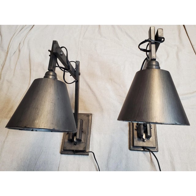 This is a pair of plug in wall sconces. They are fully metal, which is painted in a rustic patina. They are adjustable in...