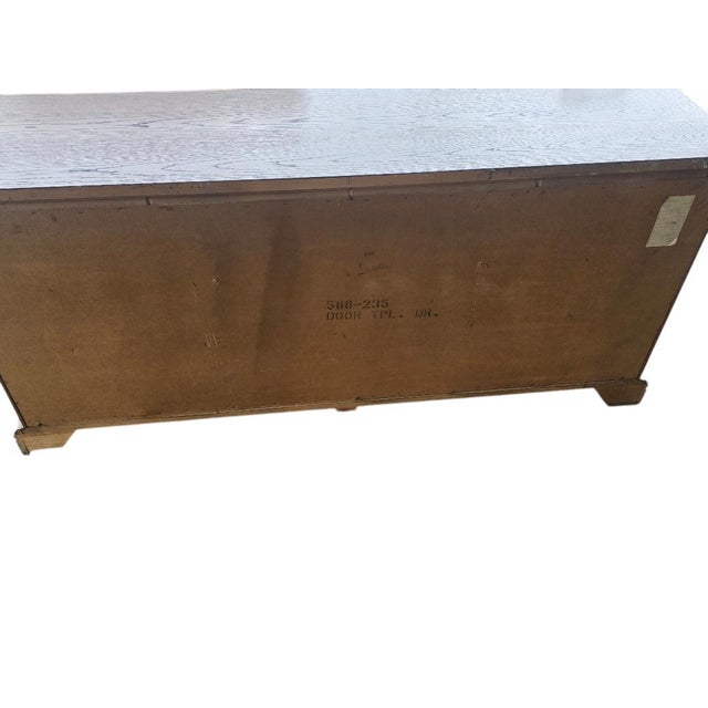 Beautiful vintage Dixie Furniture triple dresser crafted in richly grained oak with classic traditional styling. Featuring...