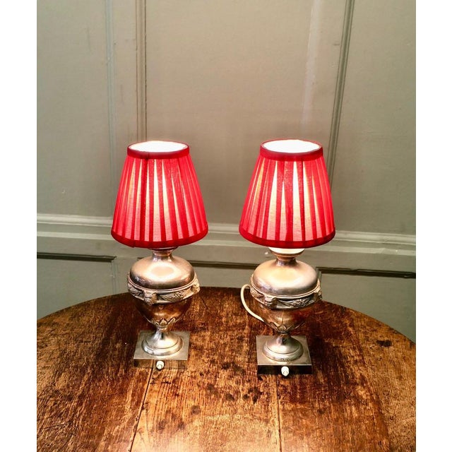 A Pair of Gothic Style Silver Plated Table Lamps These unusual Lamps have an urn shaped base with gothic characters around...
