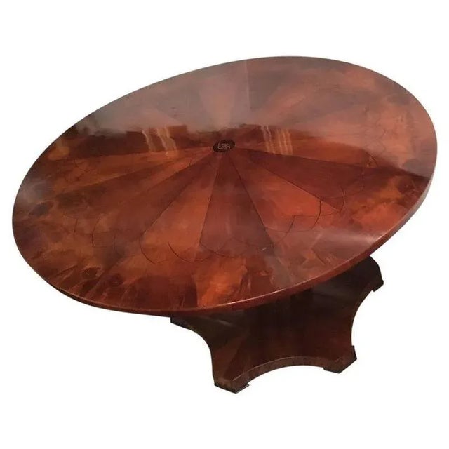 American deco pedestal table. Scallop base, round top. Flame mahogany with ebony inlay.