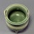 This Chinese Longquan celadon porcelain incense burner is decorated with delicate carved patterns covering the rounded...