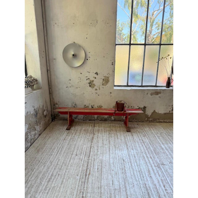 Antique bench from the 1950s, reminiscent of community benches, made of solid oak and pine. We love the original red...